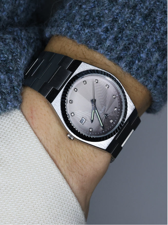 Man wearing Lenor Graphite watch with sleek graphite dial and durable stainless steel strap