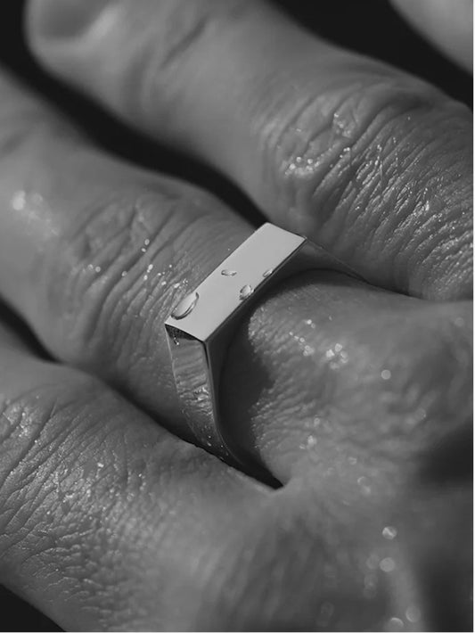 Sleek silver stainless steel ring with polished surface, hypoallergenic and water-resistant, suitable for daily wear