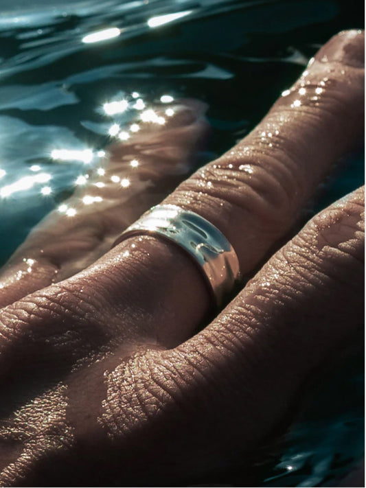 Bold silver ring for a subtle masculine look