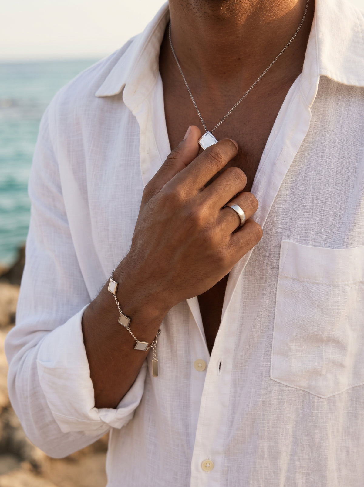 Man wearing louvond prisma bracelet and prisma necklace