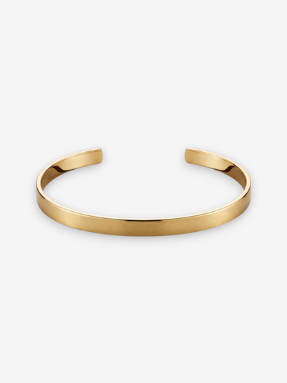 Minimalistische LOUVOND Orien armband in goudkleurig metaal met een elegante, geborstelde afwerking.