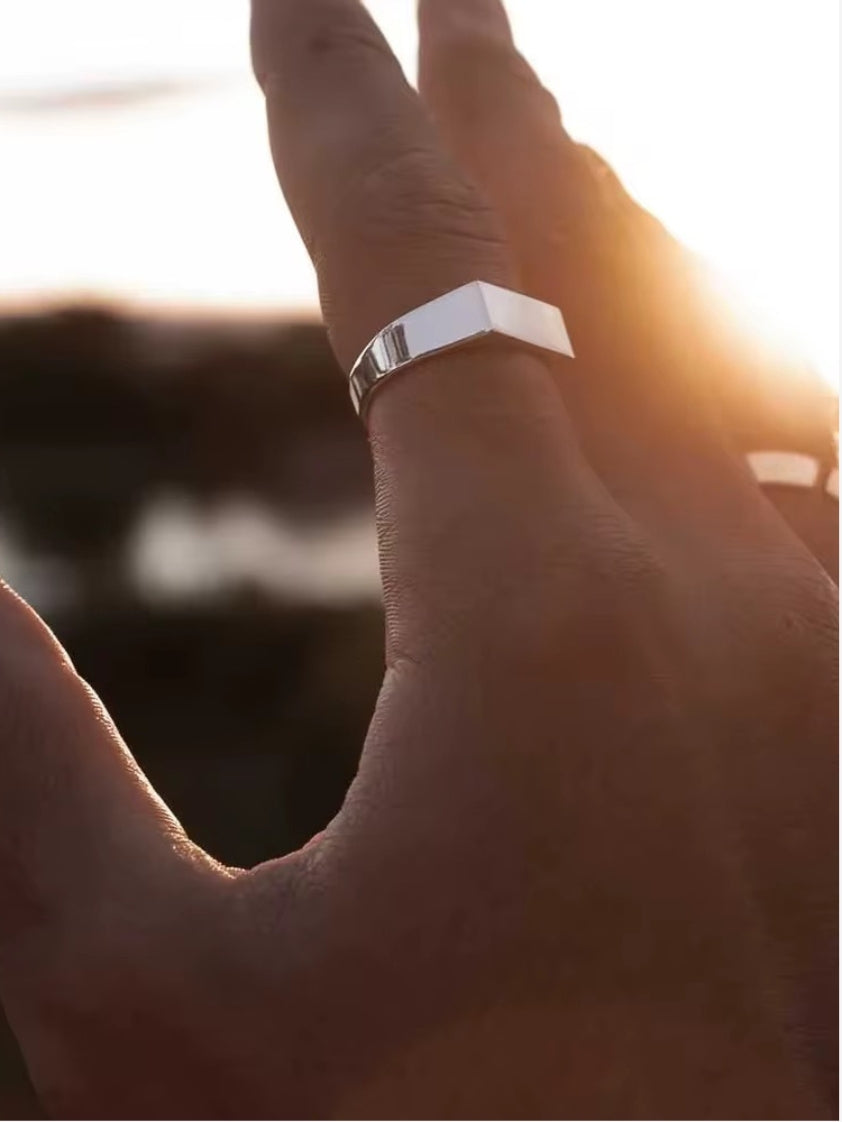 Sleek silver stainless steel ring with polished surface, hypoallergenic and water-resistant, suitable for daily wear