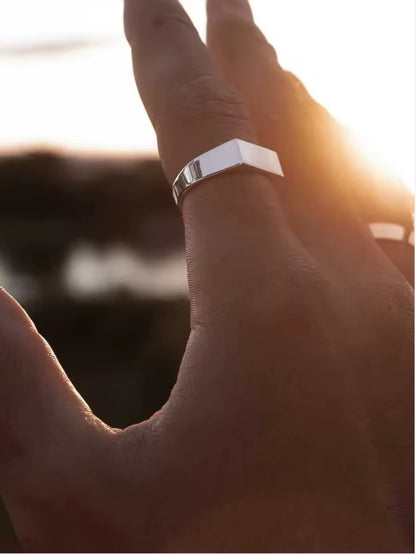 Sleek silver stainless steel ring with polished surface, hypoallergenic and water-resistant, suitable for daily wear